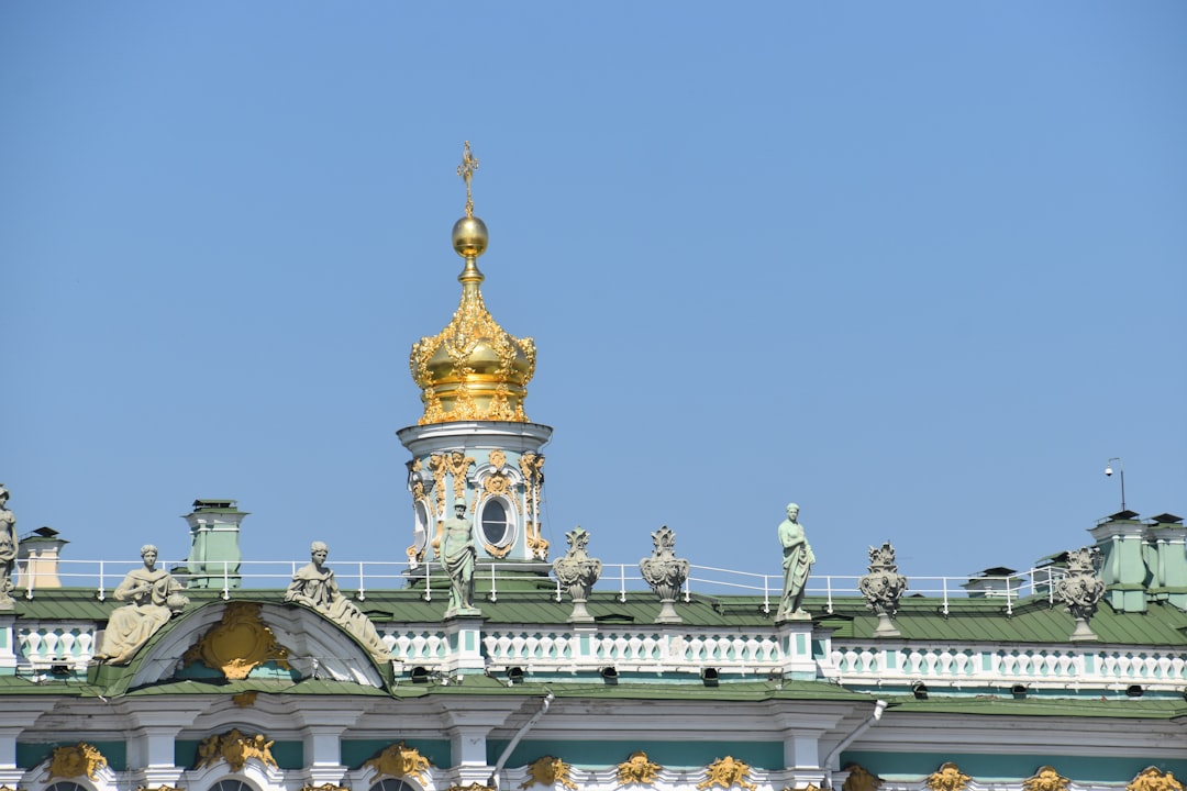 a gold and white building with a clock tower